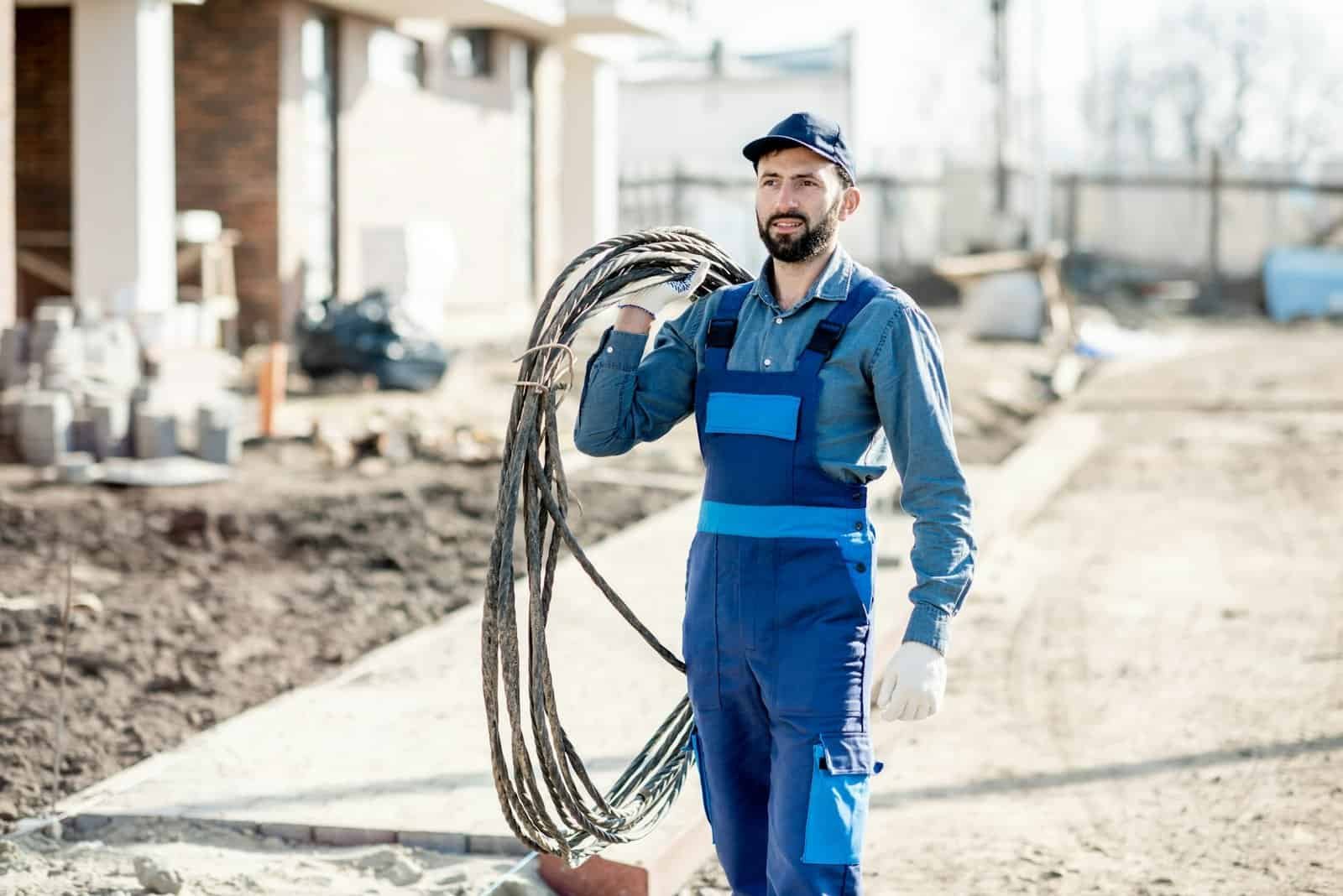 Electrician portrait with power cable