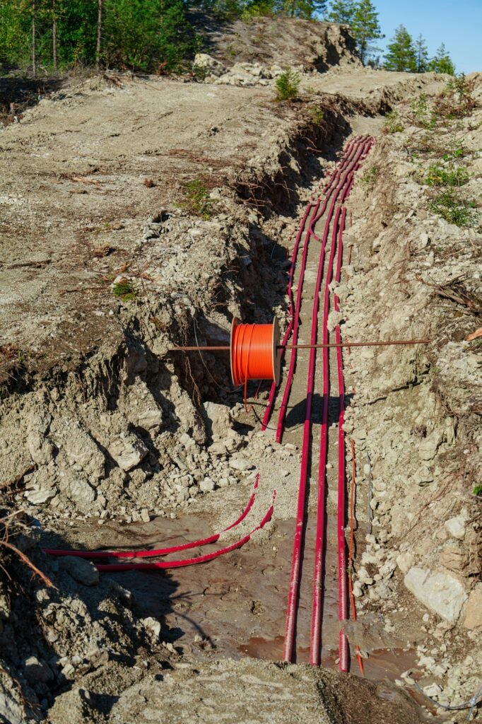 Laying High-Voltage Cables Underground Through the Forest to Connect Wind Turbines to the Power Grid